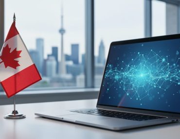 Small Canadian desk flag beside a laptop with an abstract link network on screen, in a modern office with the Toronto skyline softly blurred in the background