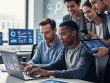 “Marketing team collaborating at desks with laptops and mobile devices, representing integrated SEO and SEM services in 2026.”
