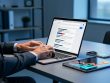 Marketing strategist using a laptop and mobile devices in a modern office, representing paid search campaign optimization and conversion-focused performance.
